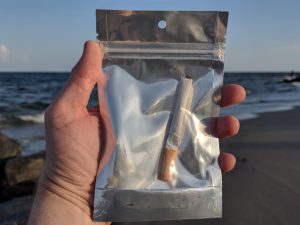 Enjoying American Kratom cigarettes on the beach