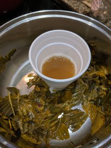 kratom tea in pot in cup